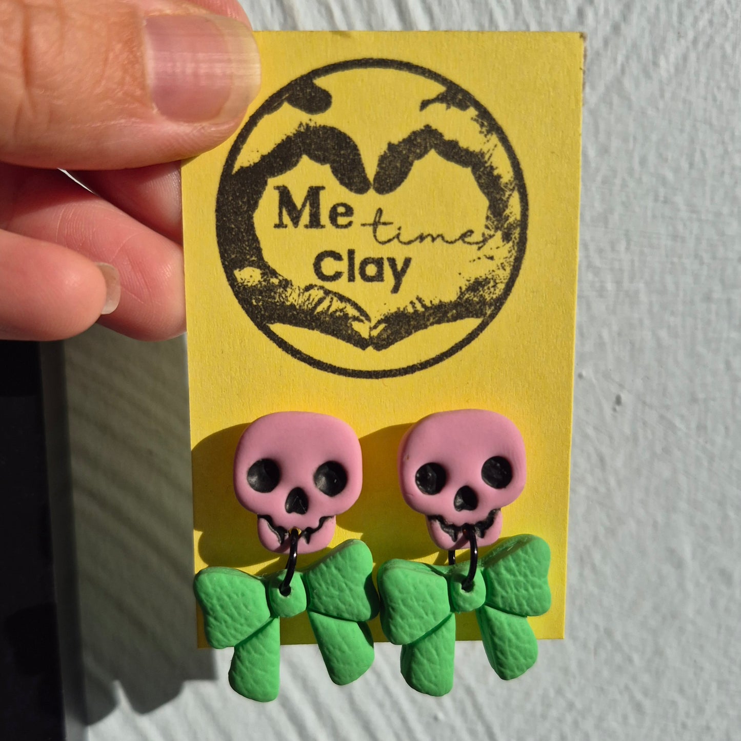 Cute halloween dangle earrings, skull + bow, light pink + green