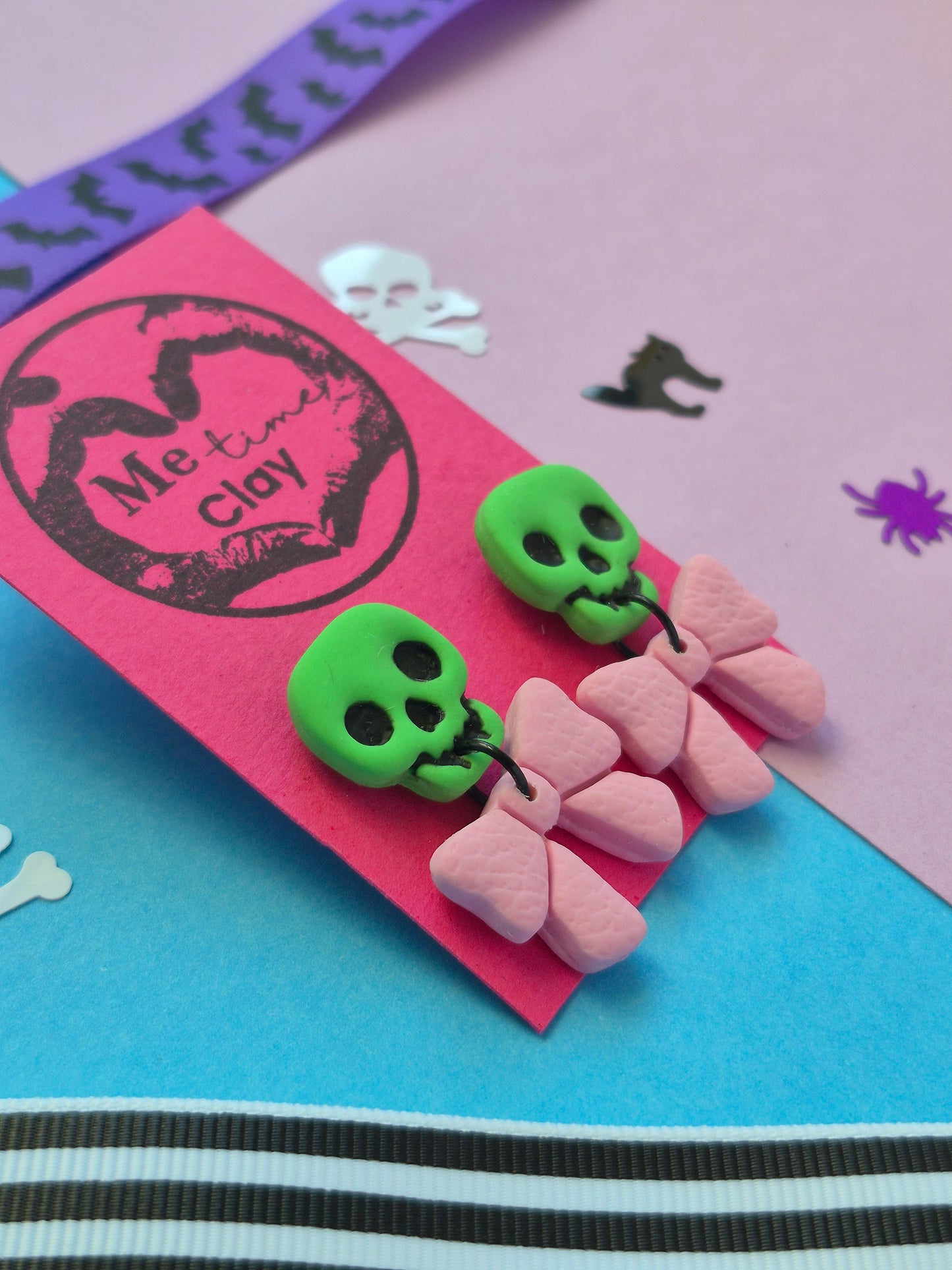 Cute halloween dangle earrings, skull + bow, green + light pink