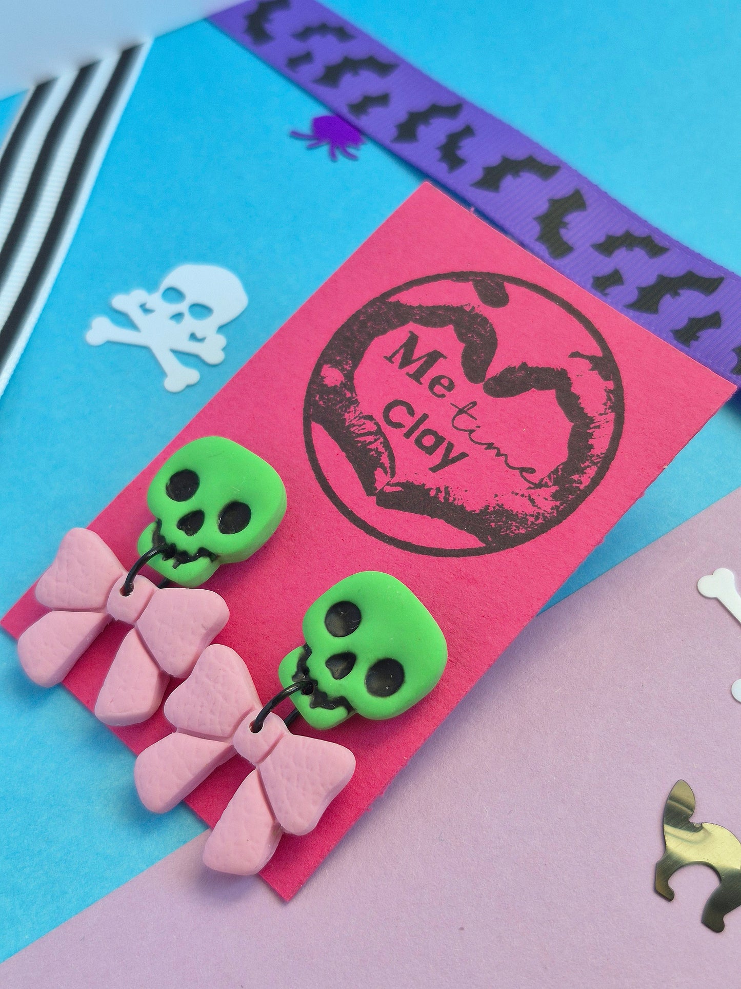 Cute halloween dangle earrings, skull + bow, green + light pink
