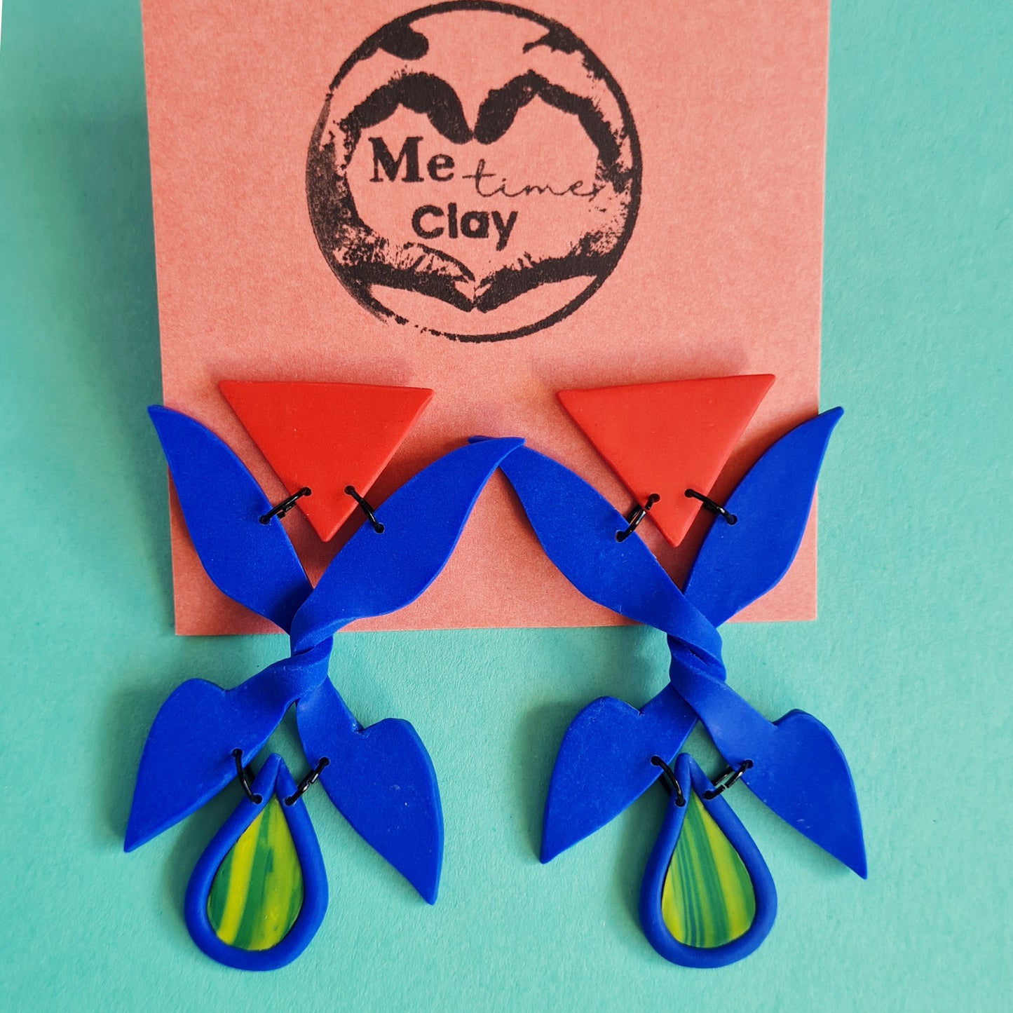 Trick me blue X shape triangle dangle earrings