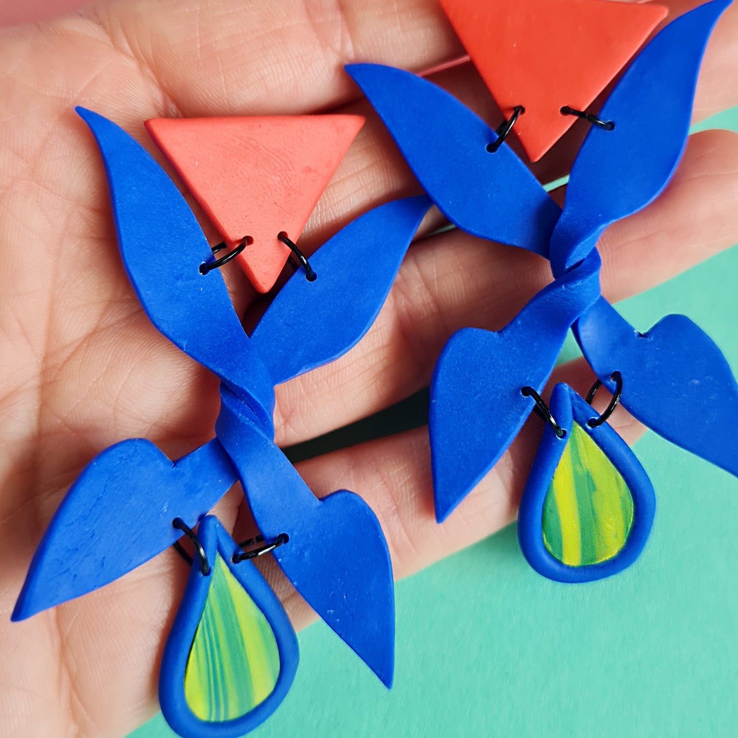 Trick me blue X shape triangle dangle earrings