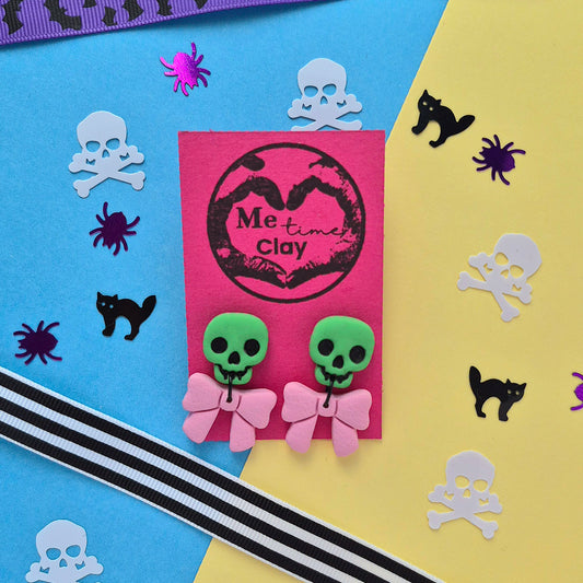 Cute halloween dangle earrings, skull + bow, green + light pink