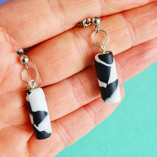 Black & white spotted cylinder dangle earrings