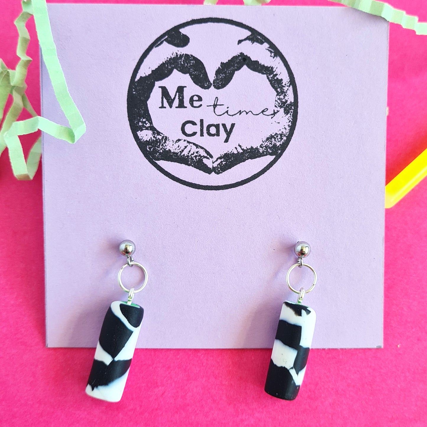 Black & white spotted cylinder dangle earrings