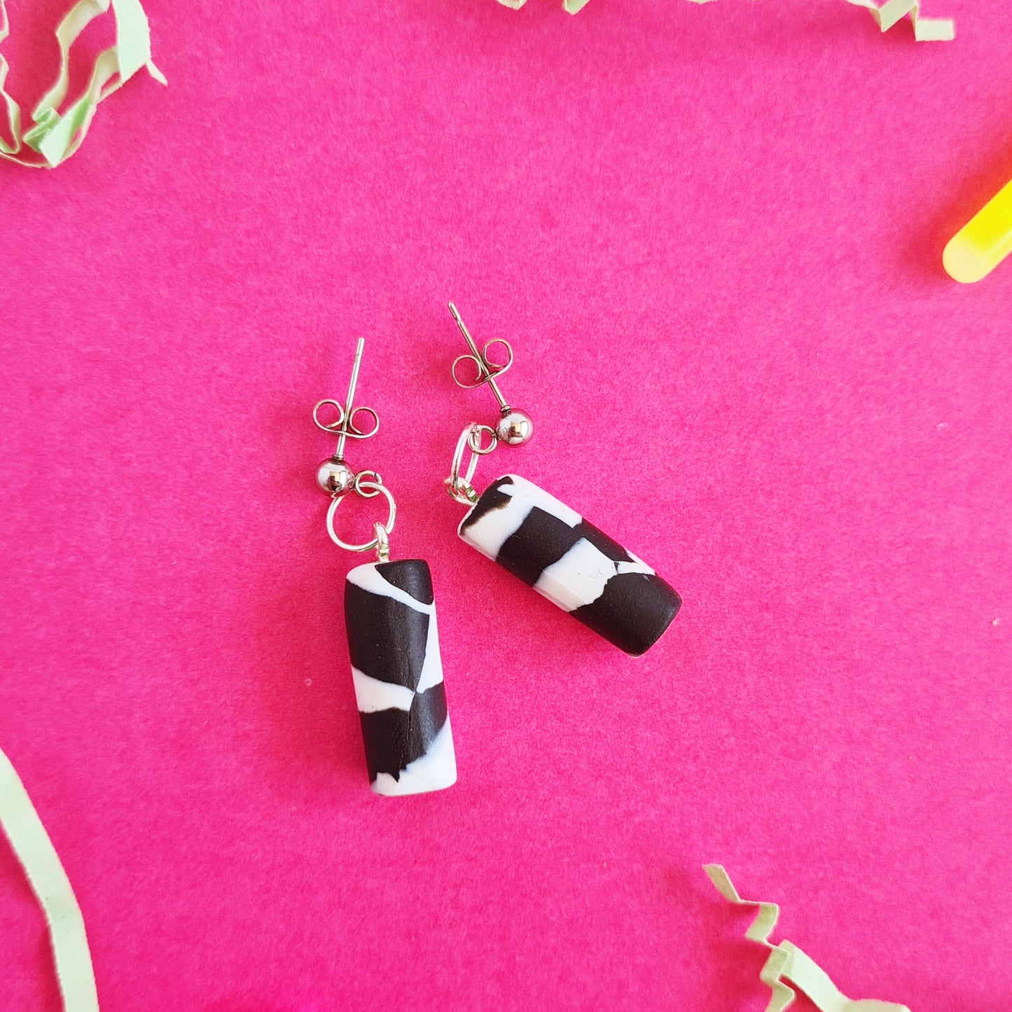 Black & white spotted cylinder dangle earrings