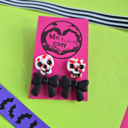 Cute halloween dangle earrings, skull + bow, white-bloody + black